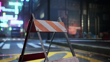 a barricade in a neon city at night