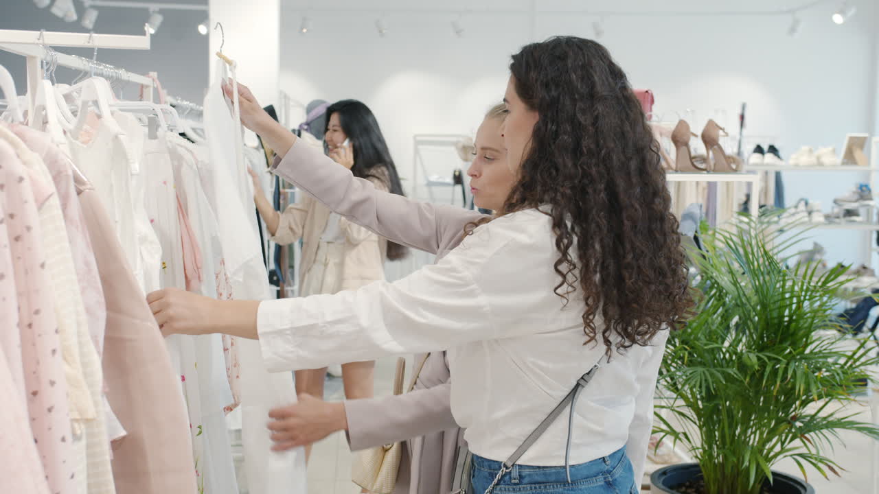 Women Shopping for Clothes in a Fashion Boutique