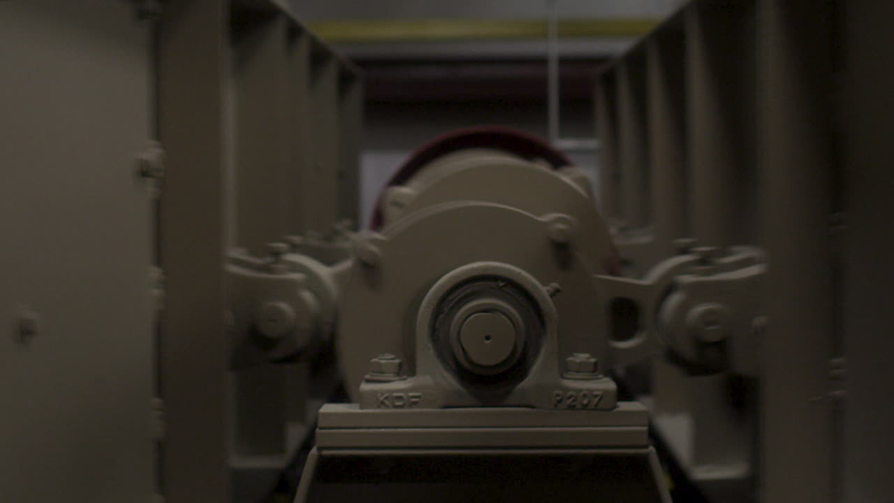 A rice mill undulates as it sifts through the rice at the first stage of rice production.