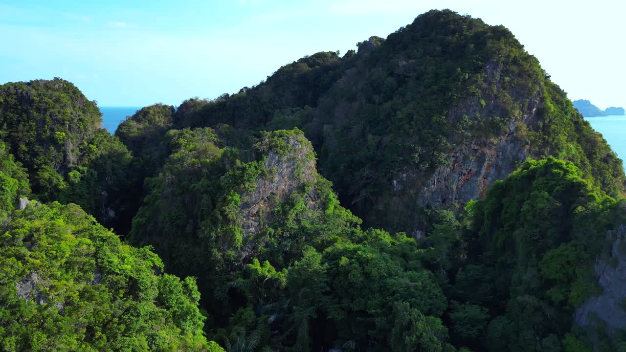 Railay Beach and Phra Nang Cave Beach in Krabi, Thailand, featuring limestone cliffs and turquoise water. Unique aerial view flight overflight flyover drone