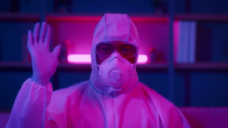 person in protective suit and mask