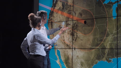 scientists monitoring a natural disaster and solar flare