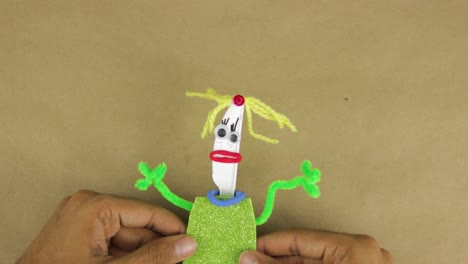 disposable plastic knife turned into toy figurine from scrap materials