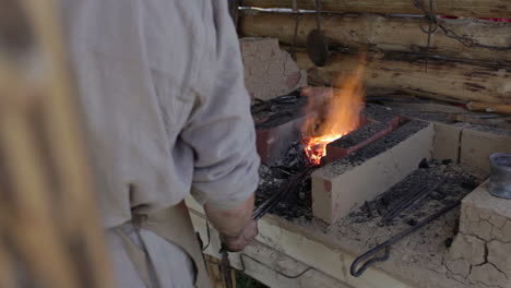 blacksmith forges iron