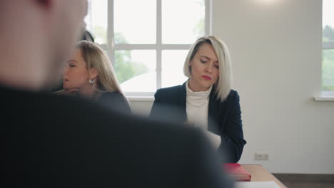 young female specialists are sitting in conference hall during training for marketing and seo