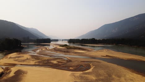 British-Columbia-BC-Canada-Travel-Drone-Footage-of-Mountain,-Trees,-and-Lakes-During-Wildfire