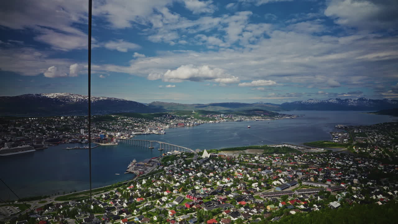 Panoramic view of Tromso, Norway from a high viewpoint.
High view of the nordic city, the landscape and the beautiful Norwegian fjords.