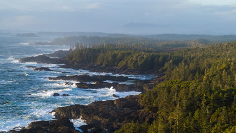 drone video at sunset in ucluelet british columbia, canada over the ocean and forest