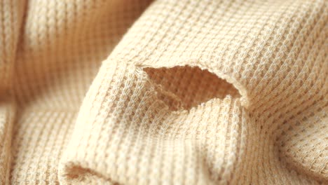 torn beige waffle knit fabric