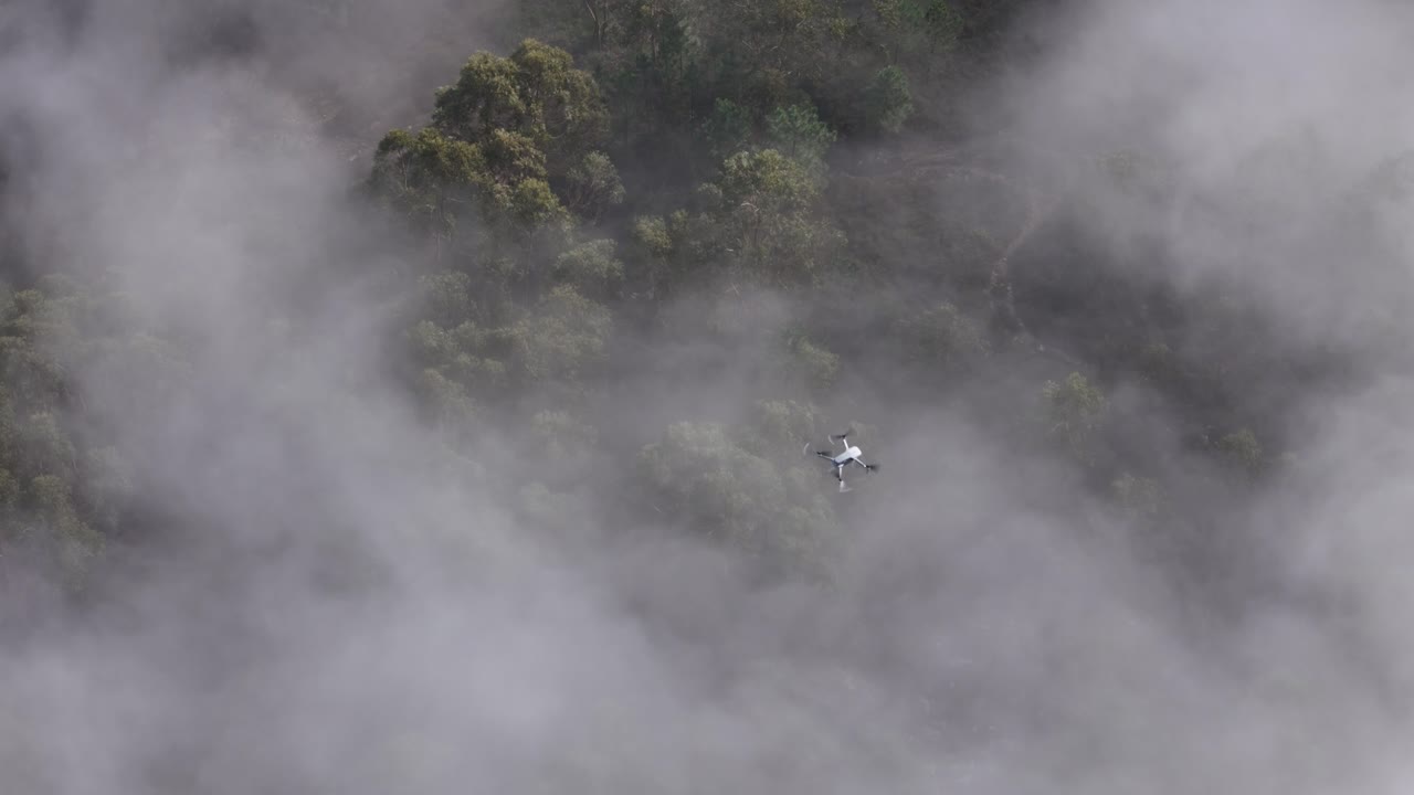 Drone flying above the low clouds 2