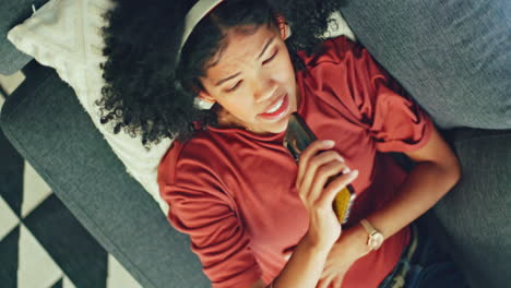 woman, phone and singing on sofa