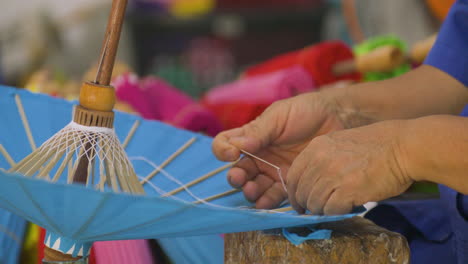 hand-made umbrellas with bamboo frames in bo sang near chiang mai, thailand. close-up shot