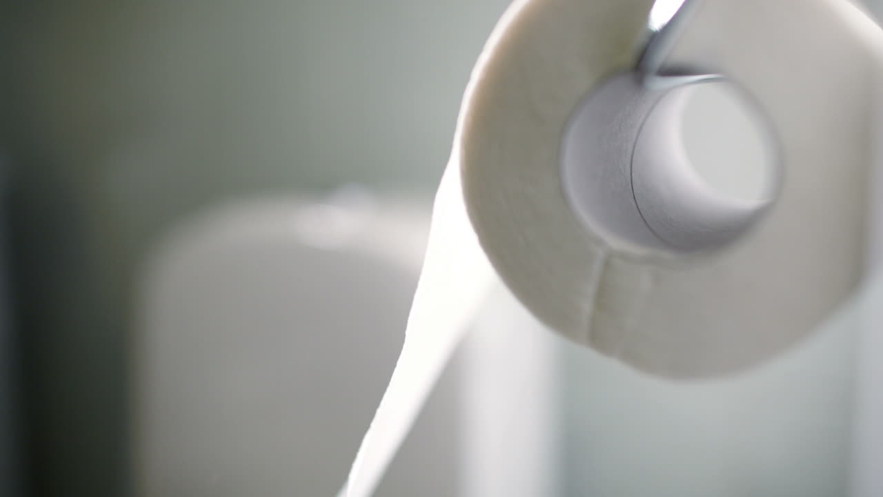 Macro shot of unrolling a toilet paper