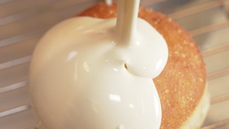 Donut-getting-covered-white-chocolate-London-bakery