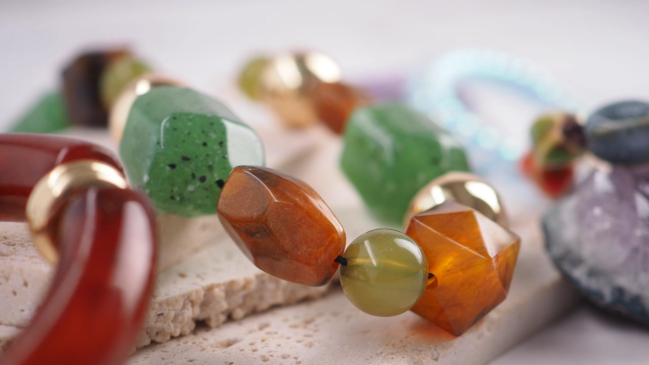Vibrant Gemstone Beads and Jewelry on White Background