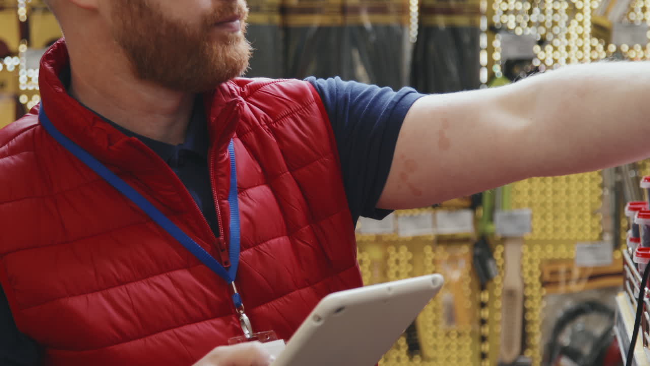 Hardware Store Supervisor Scanning Products