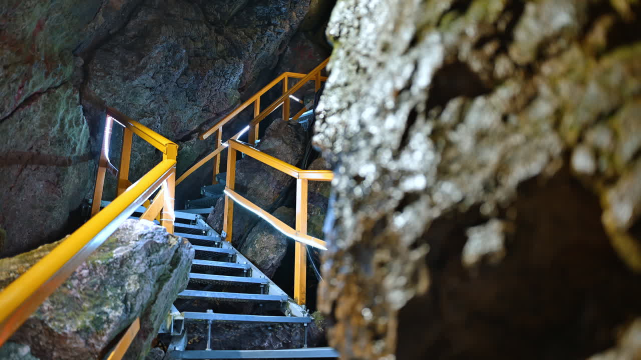 Stairs and rails inside of the Ialomita Cave in the Bucegi Mountains in Romania
