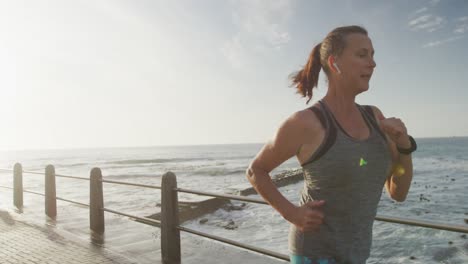 senior woman running on a promenade