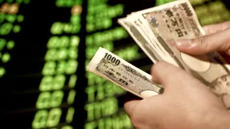 stock market in my hand is a japanese money communication marketing online, business man in the stock market office