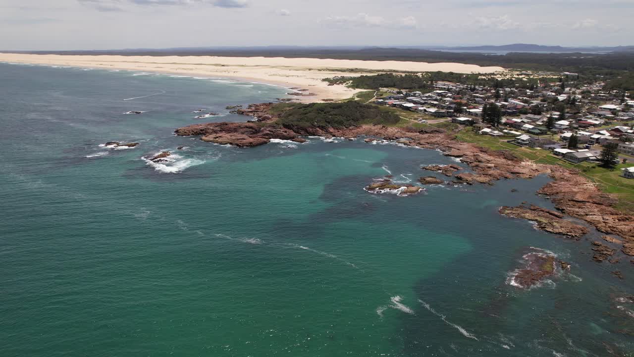 Anna Bay Point Lookout And Stockton Beach Sand Dunes On Sunny Day In Anna Bay, NSW, Australia. aerial sideways shot
