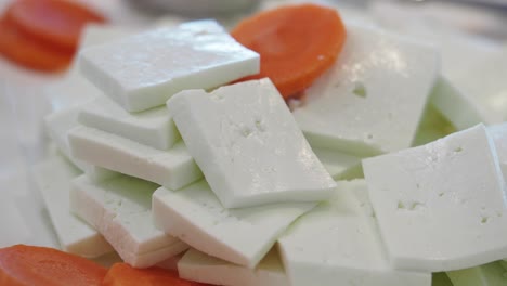 white cheese cubes with carrots