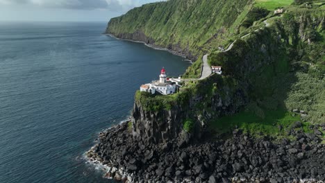 epic setting of farol ponta do arnel lighthouse on sao miguel coastline