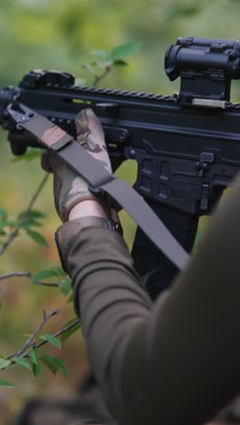 soldier with rifle in forest