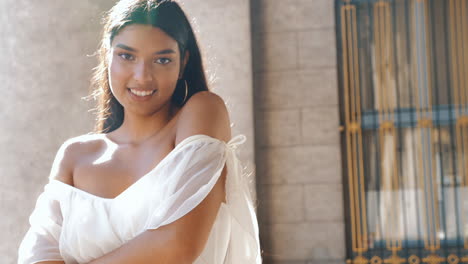 woman in a white dress posing outdoors