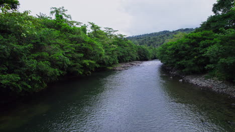 Drone-flyby-of-Caloveborita-river-in-Santa-Fe-district-in-Veraguas-province,-Panama,-by-bridge