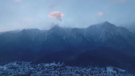 aerial view of a snow-covered mountain town in winter