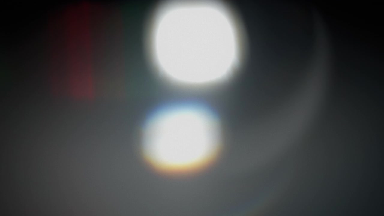 Green and red light leaks and gradient rainbow prism refractions overlays