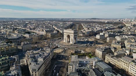 Triumphal-arch-or-Arc-de-Triomphe-with-La-Defense-in-background,-Paris-cityscape,-France