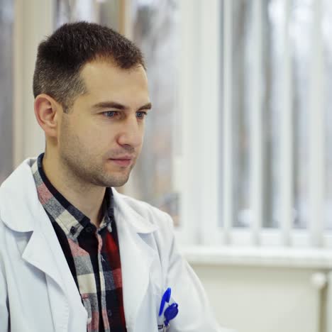 doctor is working in his medical office
