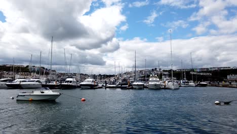 Time-lapse-shot-of-luxury-yachts-and-sailing-boat-docking-at-Brixham-Harbor-Marina,Devon