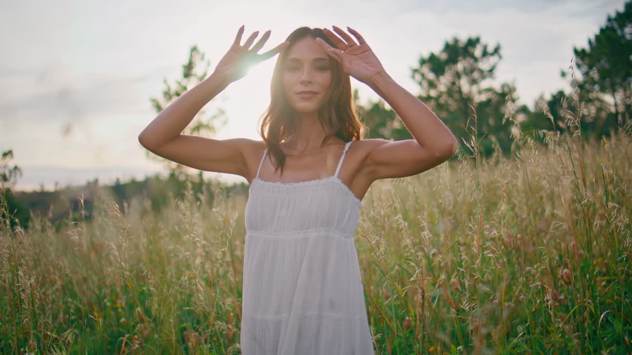 Smiling lady posing spikelets sunshine nature portrait. Woman touching hair