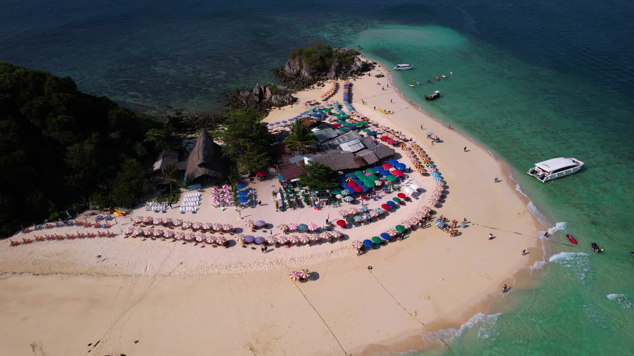 High angle drone shot orbiting the Koh Khai Nok island, sunny day in Thailand
