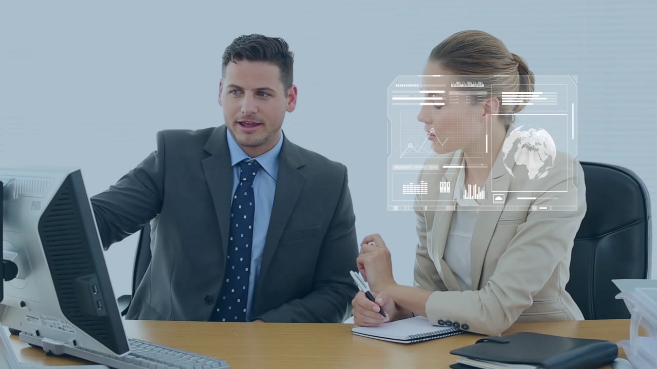 Man pointing at business monitor starting holo dash overlaying charts globe while woman noting data