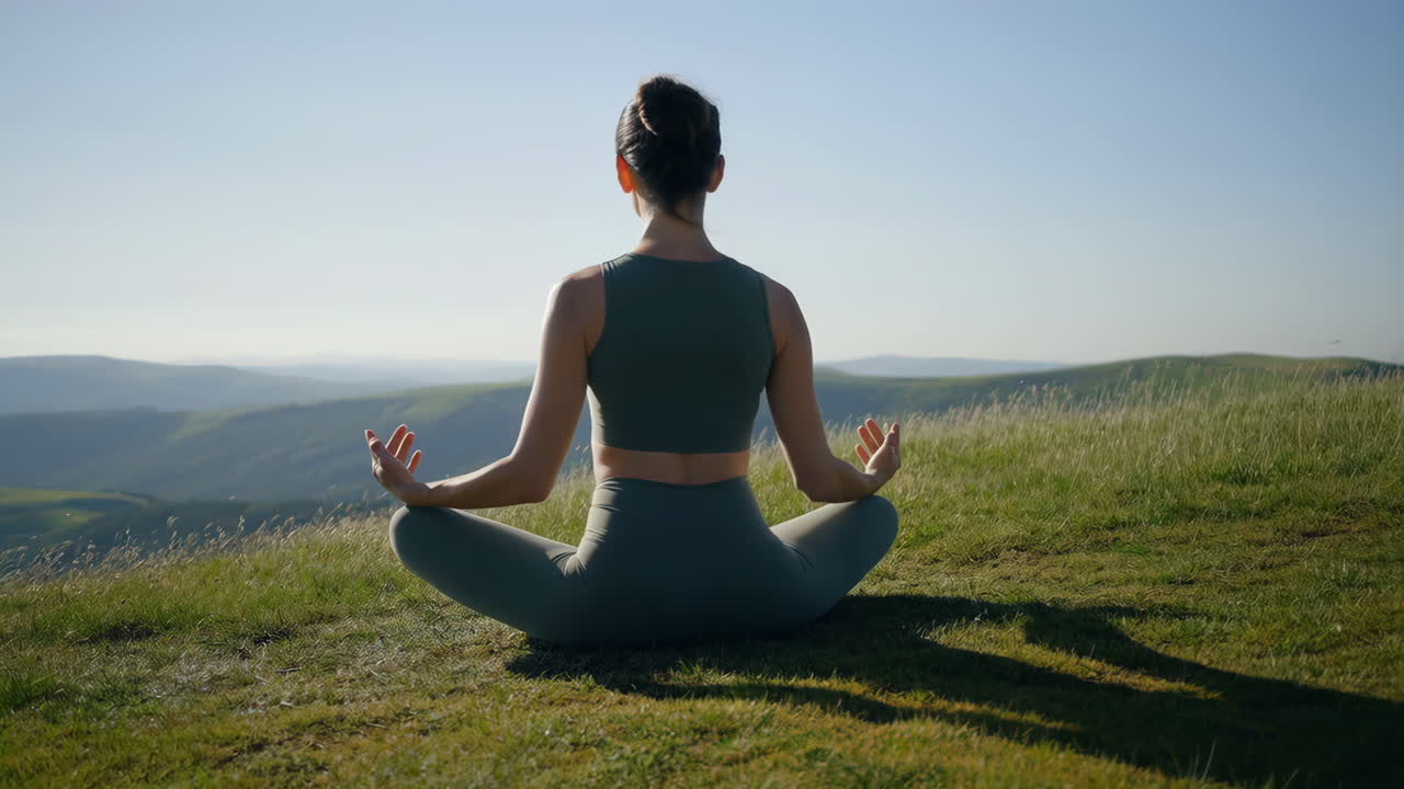 Woman Meditating in Nature on a Mountain Top