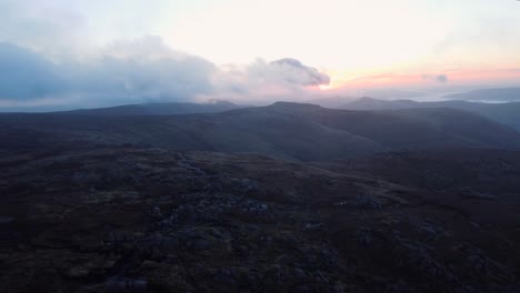 Aerial-wide-shot-over-Peak-district-mountains-in-England-during-cloudy-day-in-the-evening---panorama-shot