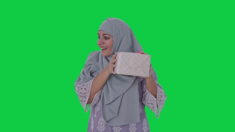 Muslim-woman-receiving-a-gift-Green-screen
