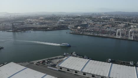 two ships pass each other in the shipping lane at a port that imports and exports business and has ample transportation