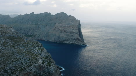 dramatic coastal scenery with misty clouds
