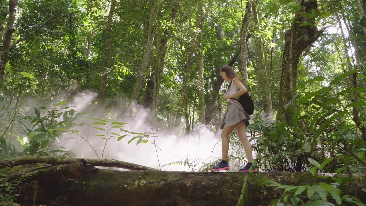 Woman Hiking in a Tropical Forest