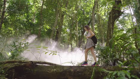 woman hiking in a tropical forest