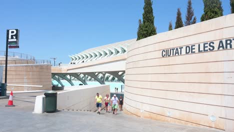 visitors arrive at the city of arts and sciences complex in valencia. it is the most important modern tourist destination in the city of valencia and one of the 12 treasures of spain.