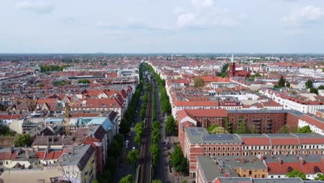 panorama elevated railroad track trees houses in street