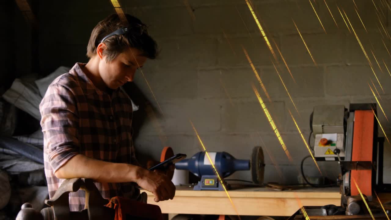 Metalworker gripping vise and filing metal for shaping with animated sparks showing contact