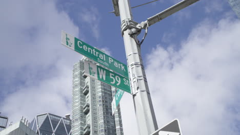 slow motion shot of a central park south street sign. Shot on a summer morning in New York City
