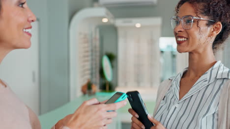 customer making a mobile payment at an optical store