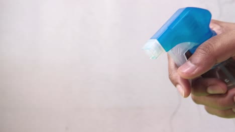 cleaning with a spray bottle and cloth